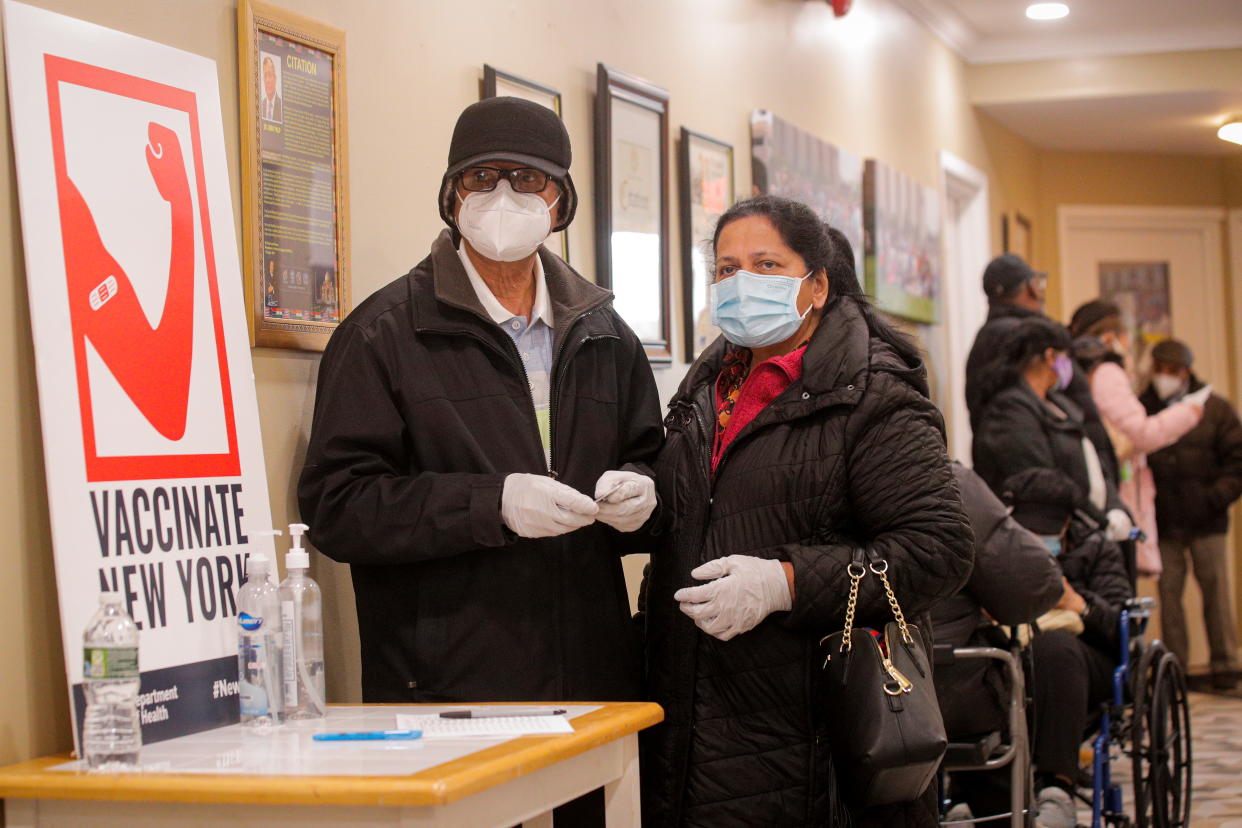 People wait in line to receive Pfizer's coronavirus disease (COVID-19) vaccine at a pop-up community vaccination center at the Gateway World Christian Center in Valley Stream, New York on February 23, 2021.  (Brendan McDermid/Reuters)