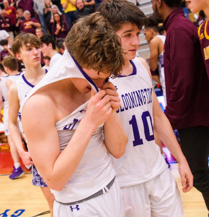 South&#39;s Andrew Baran (5) and Aiden Schmitz (10) head off the floor after the Bloomington North versus Bloomington South boys basketball sectional final at Martinsville High School on Saturday, March 5, 2022. North won the game 32-28.