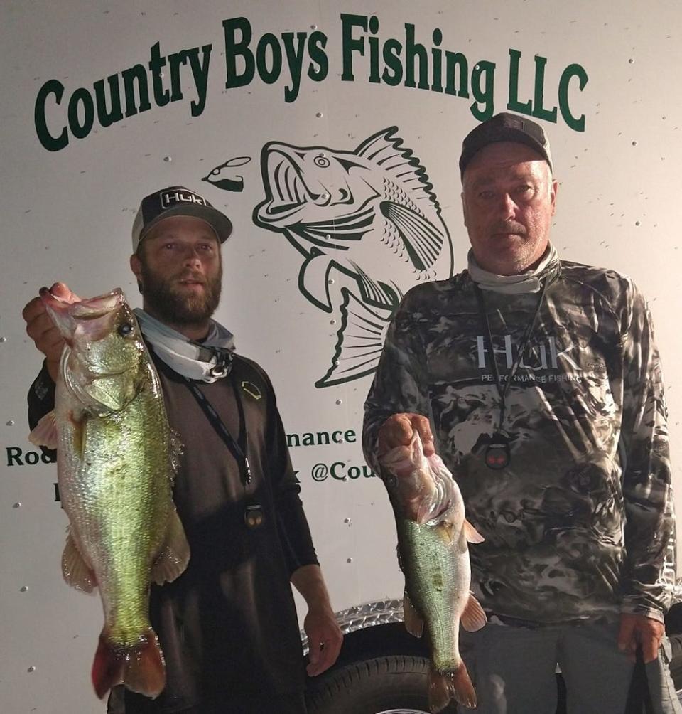 Ryan Brett, left, and Danny Duncan had 12.30 pounds and also big bass with a 6.75 pounder to win the Country Boys Fishing LLC Saddle Creek ÒMonday NighterÓ tournament July 25 on Lake Parker. 