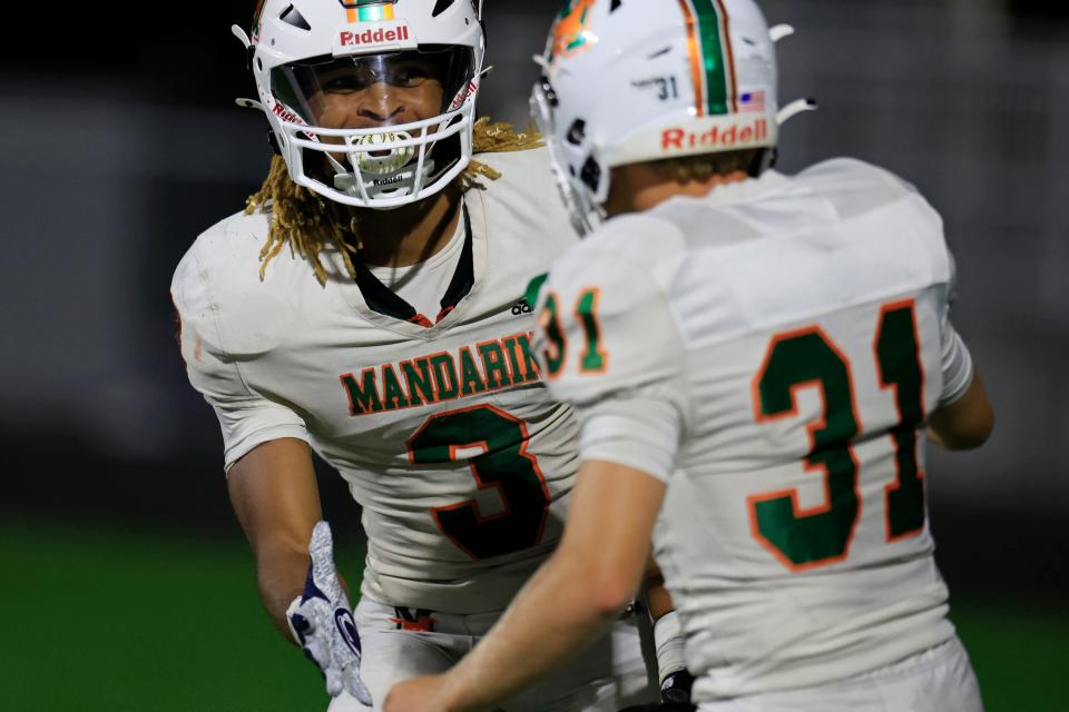 Mandarin's Antoine Belgrave-Shorter (3) reacts to his two point conversion score with Ben Hipp (31) in a September game. The Mustangs travel to Broward County to meet Monarch.