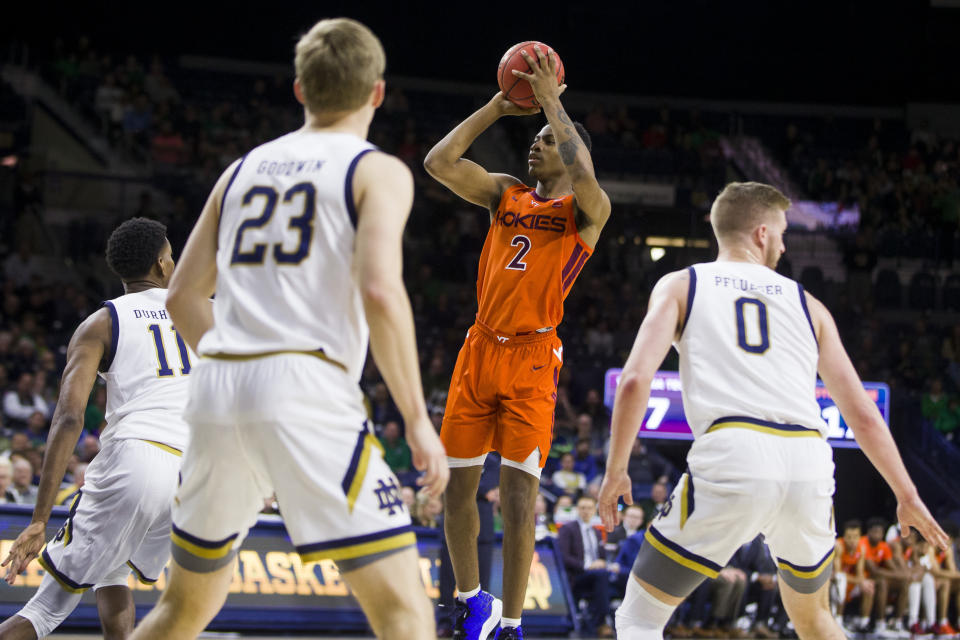 Virginia Tech's Landers Nolley II (2) goes up for a shot in front of Notre Dame's Juwan Durham (11), Dane Goodwin (23) and Rex Pflueger (0) during the first half of an NCAA college basketball game Saturday, March 7, 2020, in South Bend, Ind. (AP Photo/Robert Franklin)