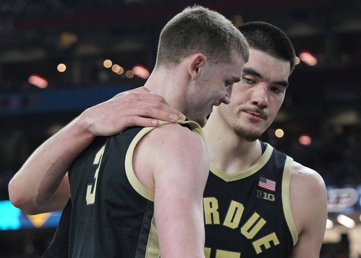 Purdue center Zach Edey consoles guard Braden Smith (3) after their loss to Connecticut in the national championship game of the 2024 NCAA men's basketball tournament, Monday, April 8, 2024, at State Farm Stadium in Glendale, Ariz.