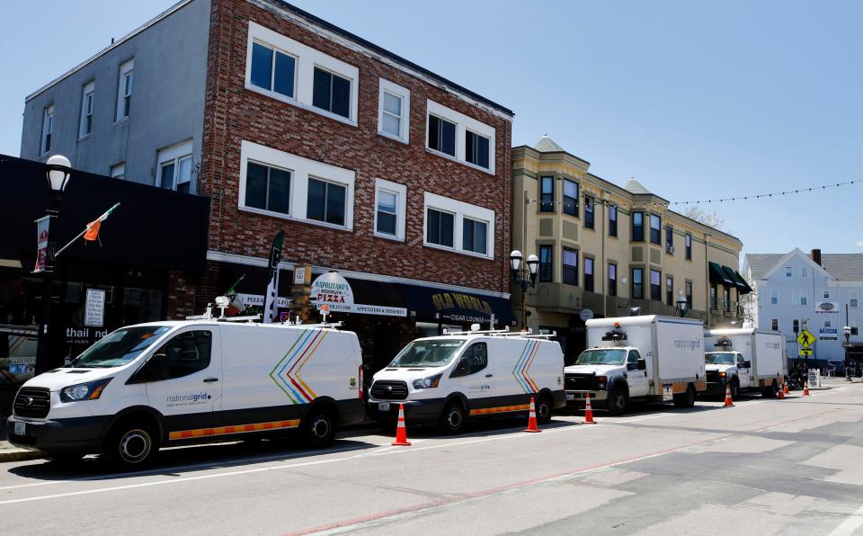 File photo of National Grid trucks belonging to crews replacing old natural gas lines on Atwells Avenue in Providence.