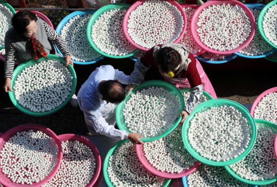 Buddhists prepare food for the winter solstice in Busan, South Korea