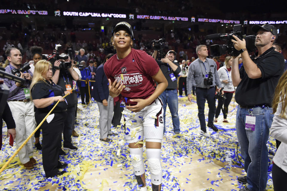 South Carolina's LeLe Grissett celebrates after defeating Mississippi State in a championship match at the Southeastern Conference women's NCAA college basketball tournament in Greenville, S.C., Sunday, March 8, 2020. (AP Photo/Richard Shiro)