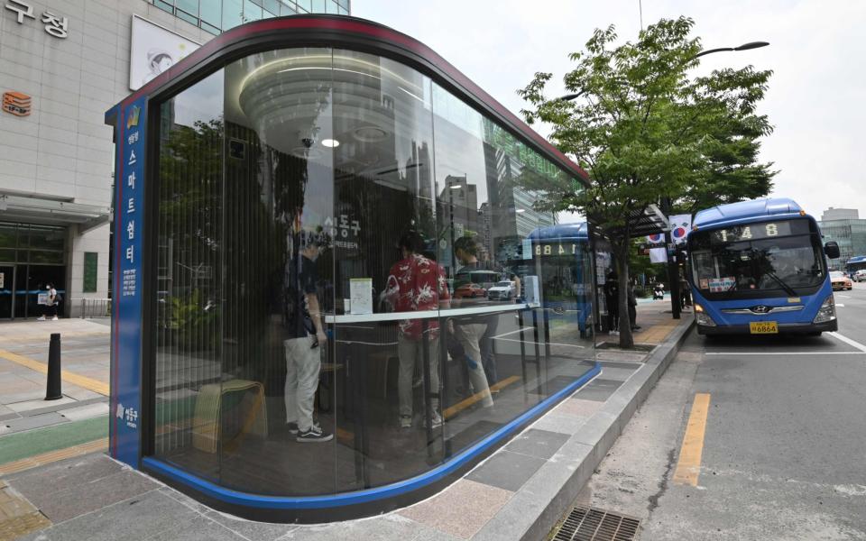 The new booths are designed to provide a safe haven both from coronavirus and the brutal summer weather - JUNG YEON-JE /AFP