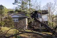 Wes Garner's residence is damaged by fallen trees which also destroyed his shed and caused a gas leak following from Tuesday night's severe weather, Wednesday, Nov. 30, 2022, in Eutaw, Ala. (AP Photo/Vasha Hunt)