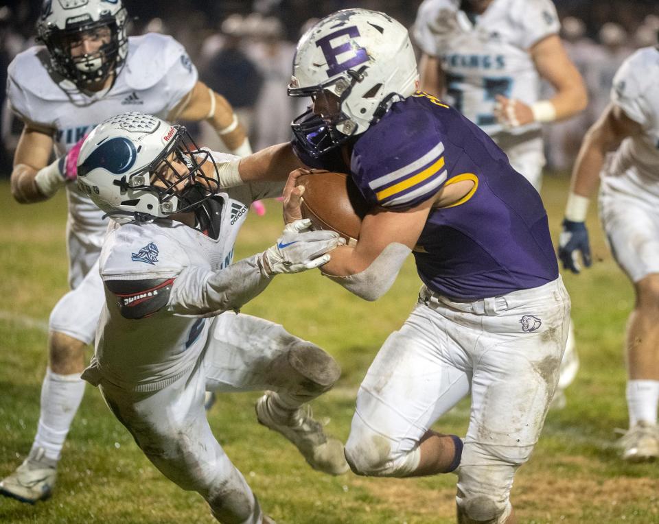 Escalon's Ryker Peters, right, fends offPleasant Valley's Parker Williams during the CIF Division 4-AA Norcal Championship football game at Escalon on Friday, Dec. 2, 2022 