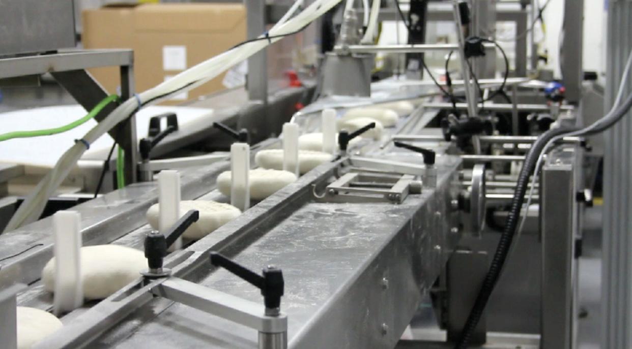 Dough moves along the production line at the present-day DeIorio's factory.