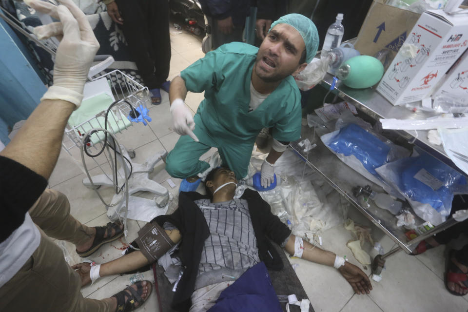 Palestinians wounded during the Israeli air and ground offensive in Khan Younis are brought to a hospital in Rafah, Gaza Strip, Tuesday, Jen. 23, 2024. (AP Photo/Hatem Ali)
