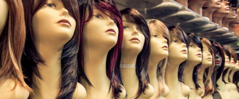 Wig shop - Row of mannequins in a peruke shop - Concepts about hairstyle,fashion and beauty