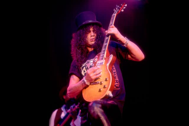 <p>Paul Natkin/Getty</p> Slash at the House of Blues in Chicago on Dec. 2, 1996