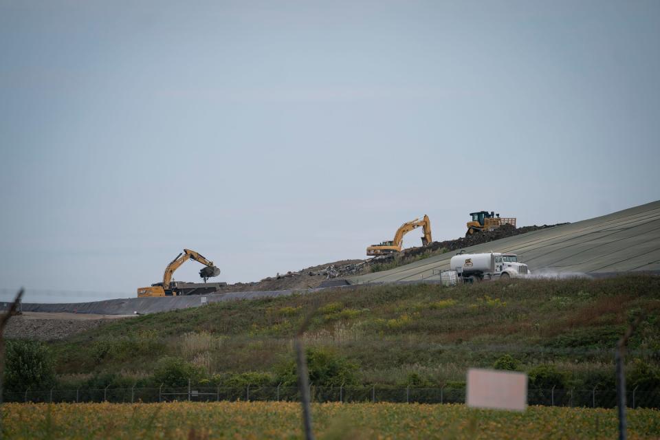 A backhoe is seen filling a dump truck at a disposal landfill, Wayne Disposal Inc. that is located in Belleville near the Willow Run Airport on Wednesday, Sept. 20, 2023.