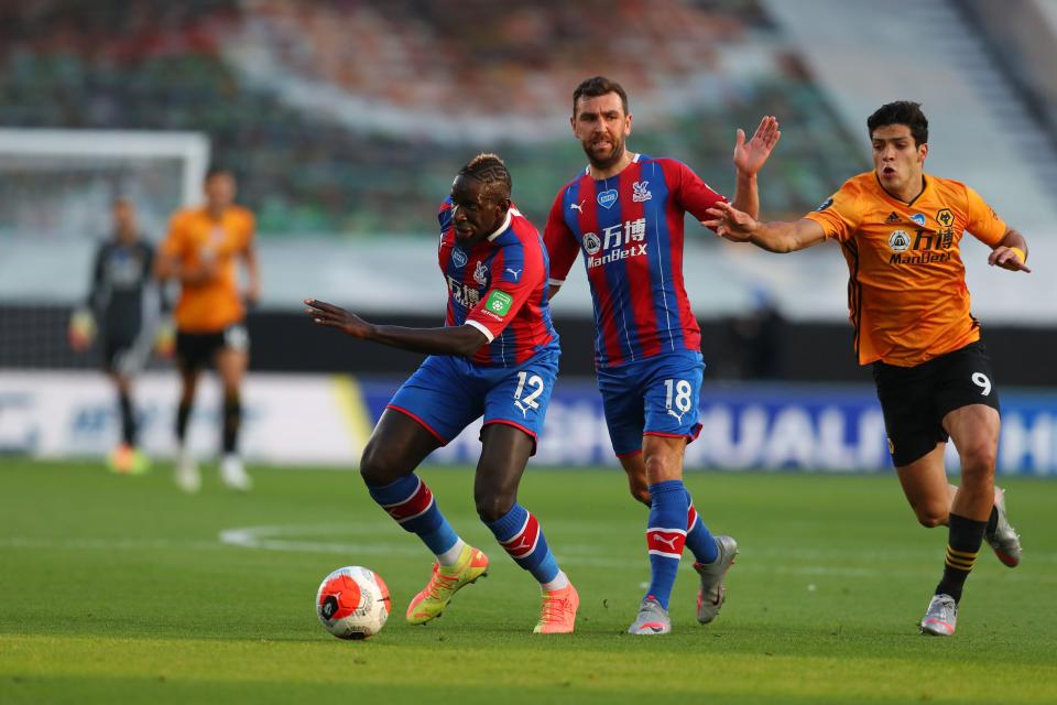 Wolverhampton Wanderers' Mexican striker Raul Jimenez (R) chases after Crystal Palace's French midfielder Mamadou Sakho (L) during the English Premier League football match between Wolverhampton Wanderers and Crystal Palace at the Molineux stadium in Wolverhampton, central England  on July 20, 2020. (Photo by Catherine Ivill / POOL / AFP) / RESTRICTED TO EDITORIAL USE. No use with unauthorized audio, video, data, fixture lists, club/league logos or 'live' services. Online in-match use limited to 120 images. An additional 40 images may be used in extra time. No video emulation. Social media in-match use limited to 120 images. An additional 40 images may be used in extra time. No use in betting publications, games or single club/league/player publications. /  (Photo by CATHERINE IVILL/POOL/AFP via Getty Images)