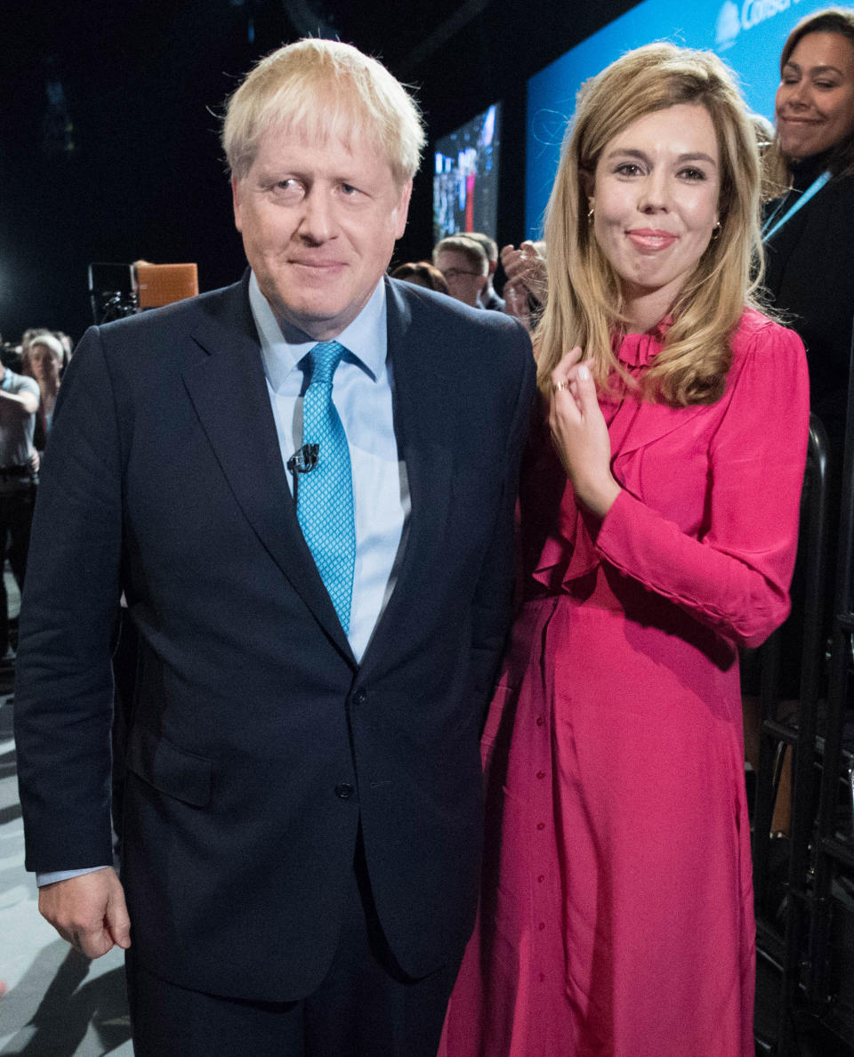 File photo dated 02/10/2019 of Prime Minister Boris Johnson with partner Carrie Symonds, they have announced that they are expecting a baby in the early summer and that they have got engaged.
