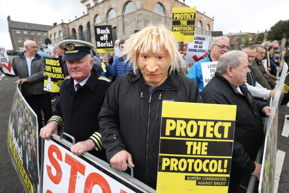 A man dressed as a customs officer and another dressed as Boris Johnson with protesters from Border Communities Against Brexit outside Hillsborough Castle (Liam McBurney/PA) (PA Wire)