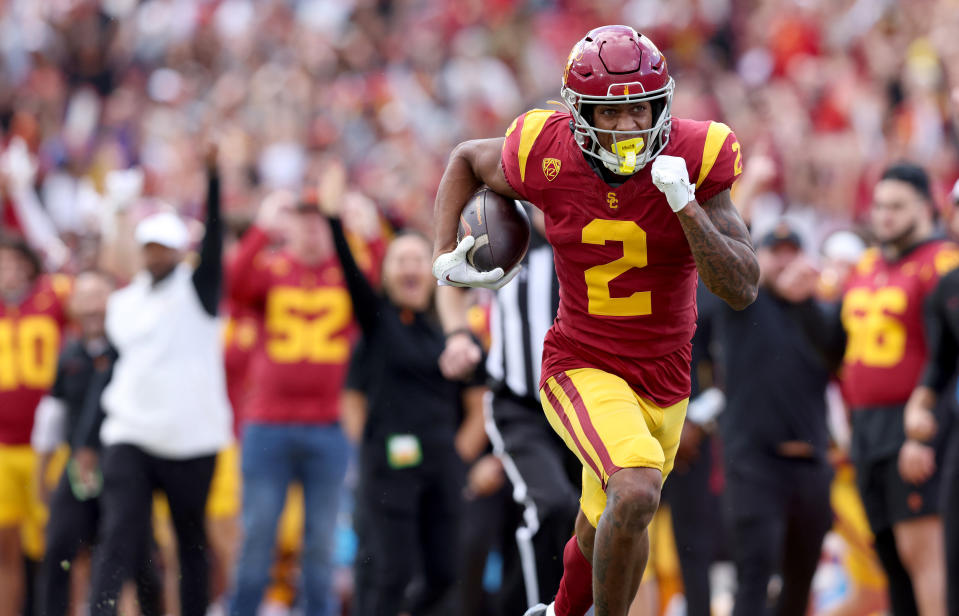 Nov 18, 2023; Los Angeles, California, USA; USC Trojans wide receiver Brenden Rice (2) catches a touchdown during the second quarter against the UCLA Bruins at United Airlines Field at Los Angeles Memorial Coliseum. Mandatory Credit: Jason Parkhurst-USA TODAY Sports