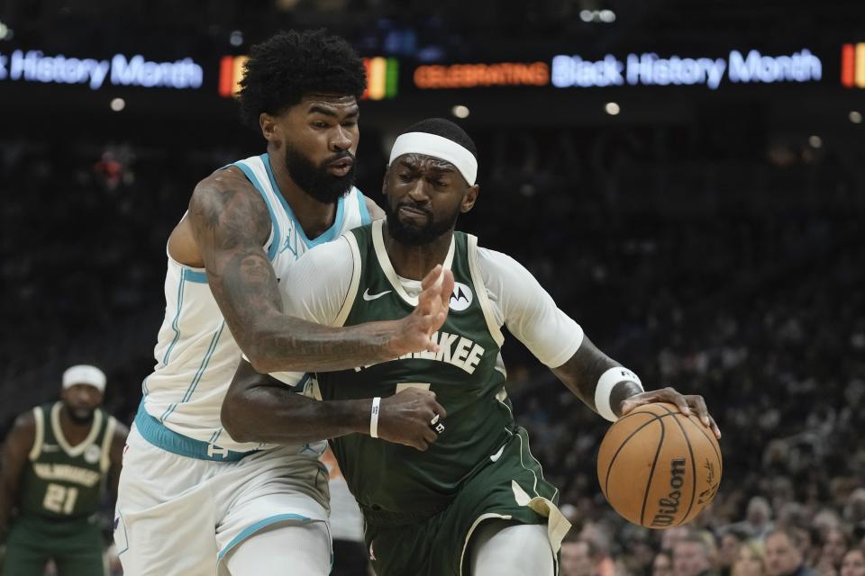 Milwaukee Bucks' Ryan Rollins tries to get past Charlotte Hornets' Nick Richards during the first half of an NBA basketball game Tuesday, Feb. 27, 2024, in Milwaukee. (AP Photo/Morry Gash)