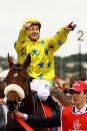 <p>Jockey Christophe Lemaire riding Dunaden celebrates winning the Melbourne Cup at Flemington Racecourse</p>