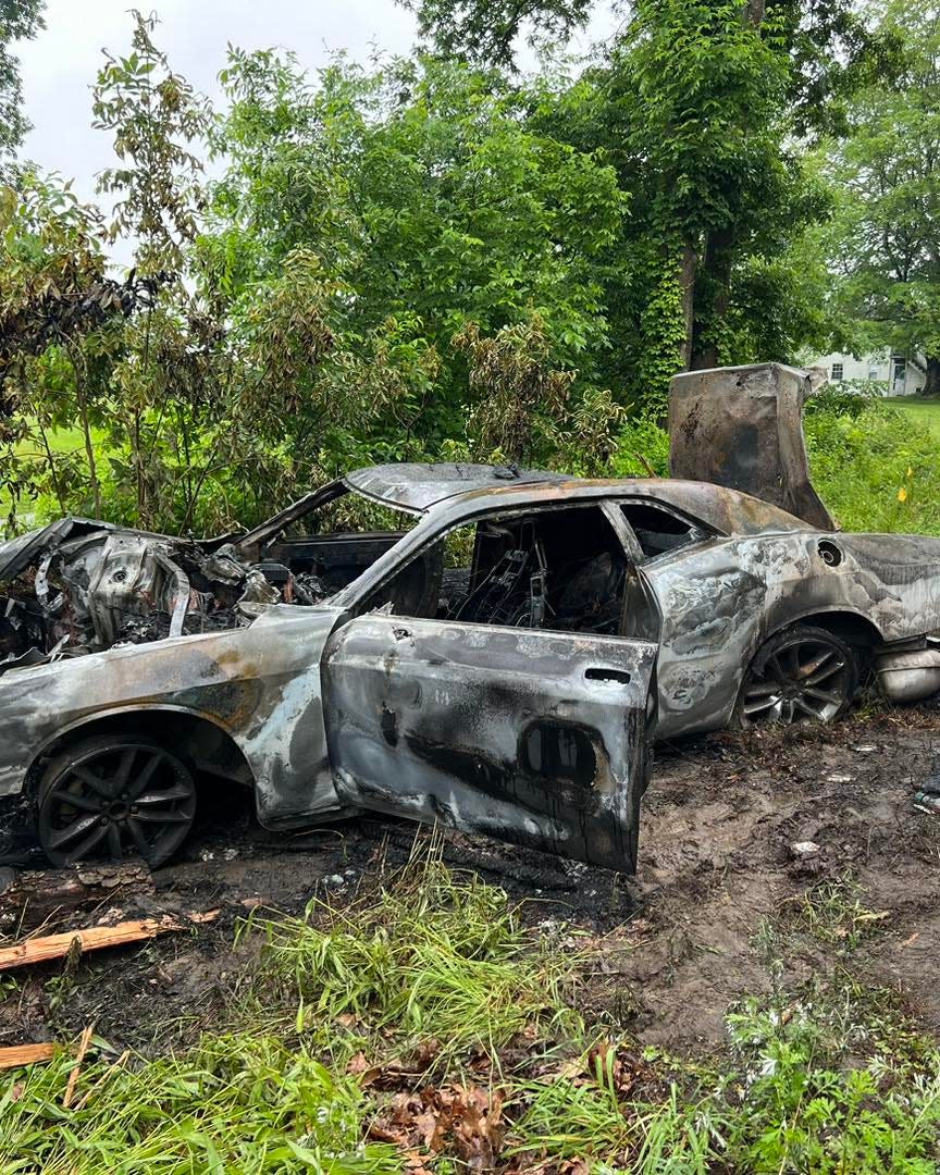 Two off-duty firefighters and an East Kingston police officer pulled 35-year-old Jamaica Johnson from her burning Dodge Challenger on Route 107 Saturday, according to East Kingston police and fire.