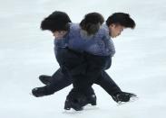 Japanese figure skater Tatsuki Machida practises in preparation for the 2014 Sochi Winter Olympics, February 4, 2014. Picture taken using multiple exposure. REUTERS/Lucy Nicholson