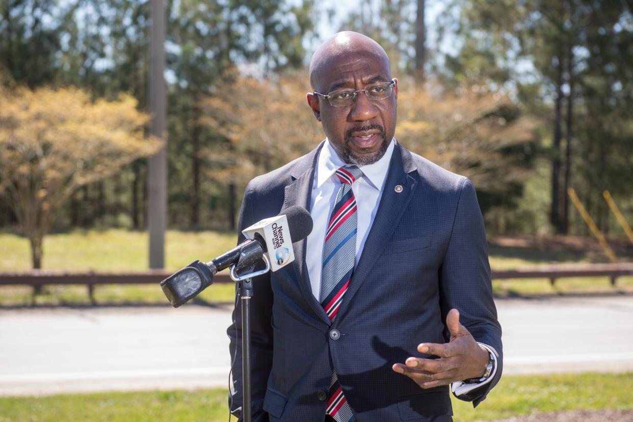 FILE - U.S. Sen. Raphael Warnock talks with reporter outside Fort Gordon after touring the facility near Augusta, Ga., Monday morning March 29, 2021. Warnock and Sen. Jon Ossoff recently introduced a bill to authorize construction of a child development center at Fort Gordon.