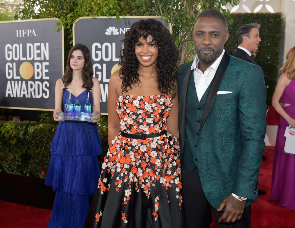 There she goes again… photobombing Sabrina Dhowr and Idris Elba. Source: Stefanie Keenan/Getty Images