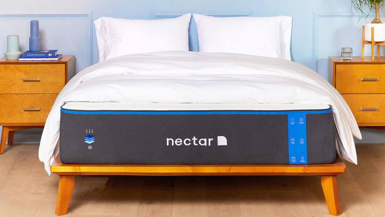  Nectar mattress review image shows the memory foam bed on a wooden frame ready for sleeping on. 
