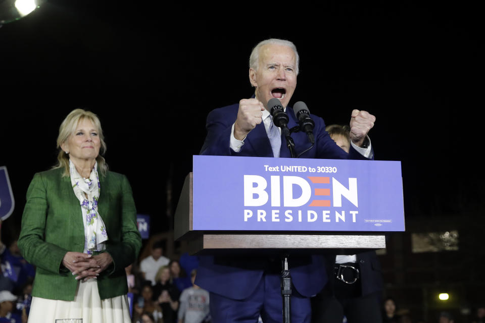 Democratic presidential candidate former Vice President Joe Biden, right, speaks next to his wife Jill during a primary election night rally Tuesday, March 3, 2020, in Los Angeles. (AP Photo/Marcio Jose Sanchez)