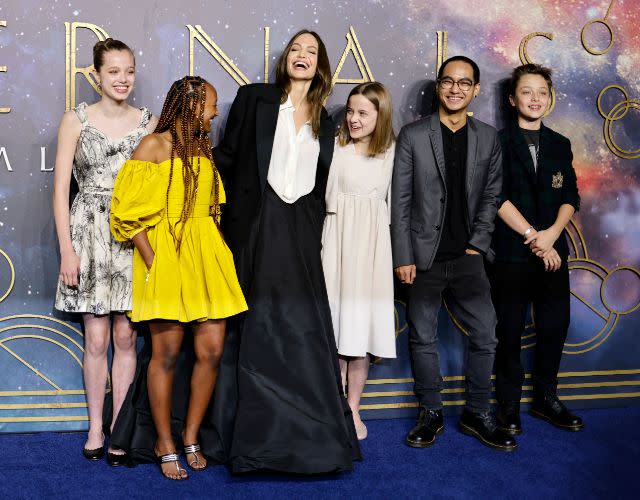 Angelina Jolie (third from left) poses with her children (LR) Shiloh Jolie-Pitt, Zahara Jolie-Pitt, Vivienne Jolie-Pitt, Maddox Jolie-Pitt and Knox Jolie-Pitt.  Photo by Tolga Akmen/AFP via Getty Images.