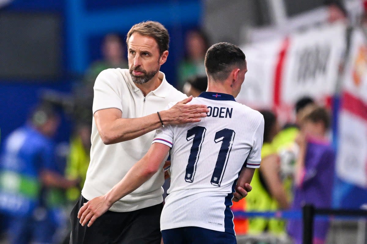 Gareth Southgate embraces Phil Foden after replacing the winger (AFP via Getty Images)