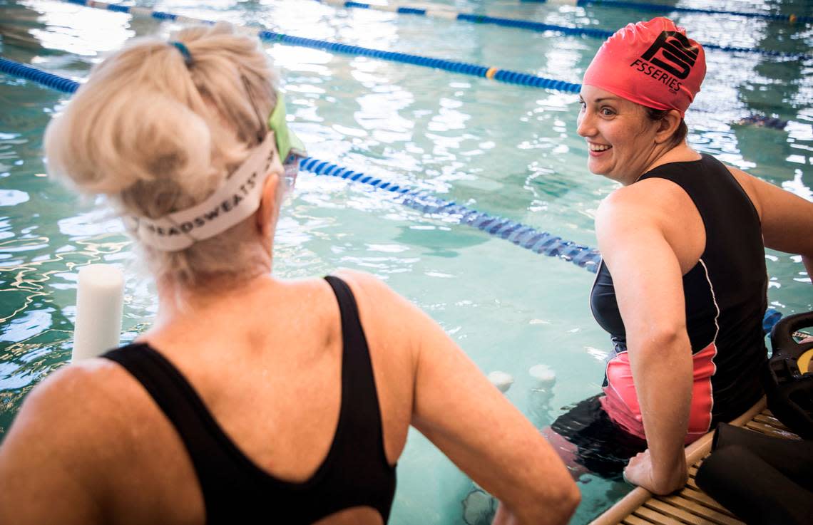 Andrea Peet, right, and her mother Sandra Lytle, left, talk as they exercise in the pool at Life Time Fitness in Cary, N.C. on Feb. 17, 2020. Peet, who is in her sixth year of living with ALS, gets a lot out of the twice weekly workouts. “I love being in the water, because I can’t fall,” she said.