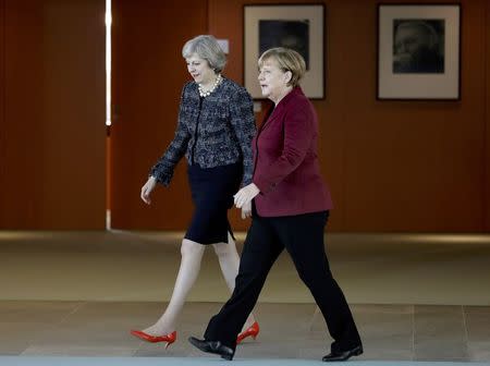 German Chancellor Angela Merkel and Britain's Prime Minister Theresa May arrive for a statement prior to a meeting at the chancellery in Berlin, Germany, November 18, 2016. REUTERS/Michael Sohn/Pool