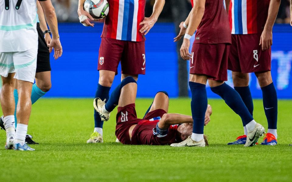 Martin Odegaard of Norway gets injured during the UEFA Nations League 2024/25 League B Group B3 match between Norway and Austria at the Ullevaal Stadion on September 9, 2024 in Oslo, Norway.