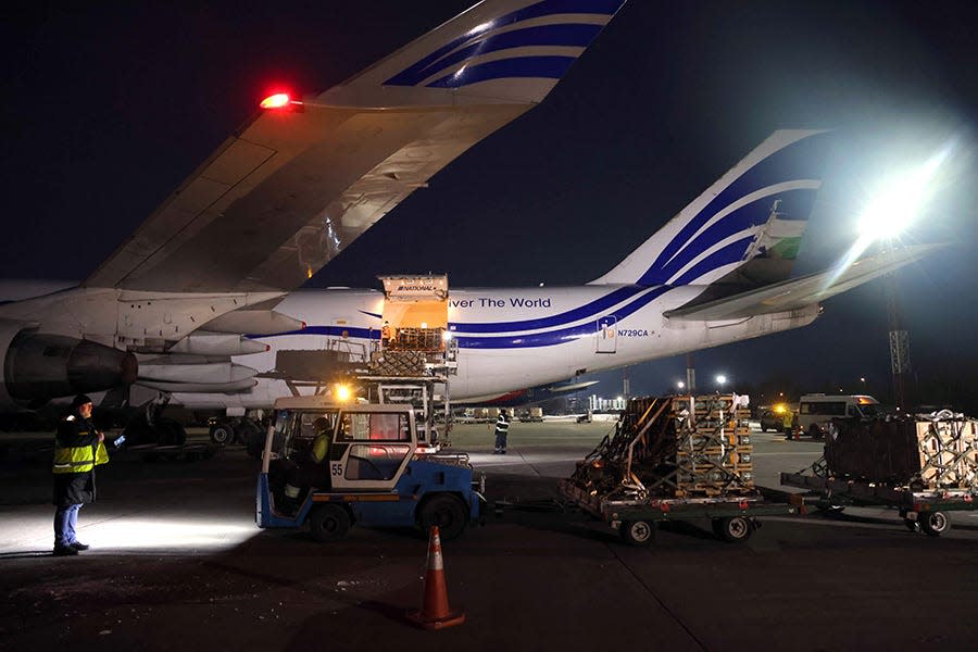 Ground crews unload weapons and other military hardware delivered by the U.S. military at Boryspil Airport near Kyiv, Ukraine, on Jan. 25.