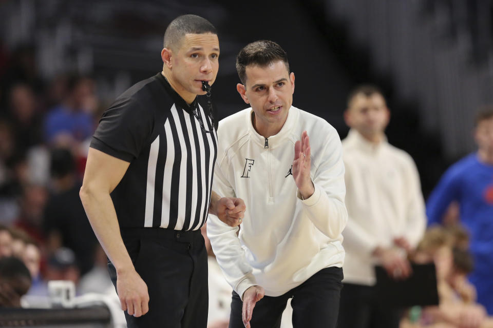 Florida head coach Todd Golden talks to a referee about a missed call during the second half of an NCAA college basketball game against South Carolina Saturday, March 2, 2024, in Columbia, S.C. (AP Photo/Artie Walker Jr.)