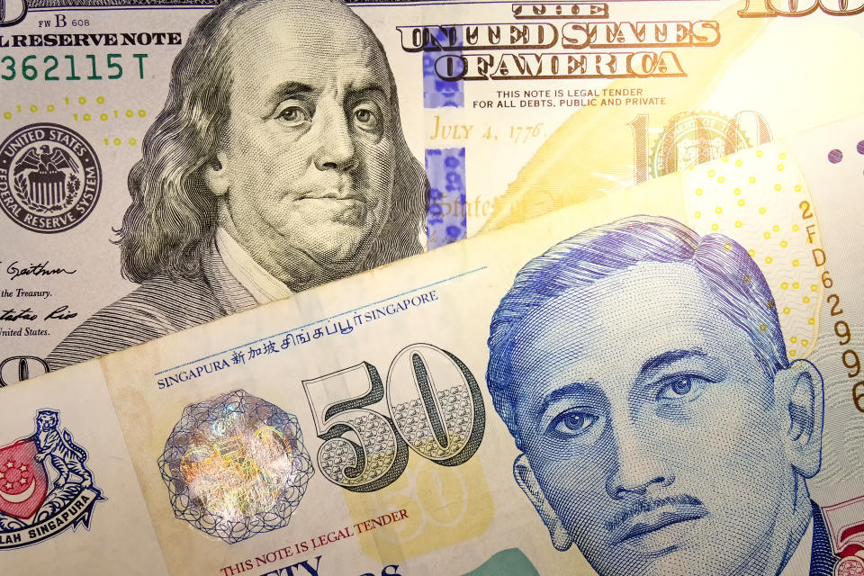 Close up view of US Dollar and Singapore Dollar indicating strong currency exchange rate