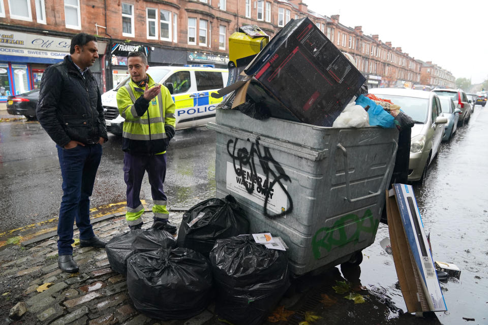 Scottish Labour leader Anas Sarwar is shown an overflowing bin by Barry McAreavey as he meets GMB cleansing workers in Glasgow to learn about their dispute with the Scottish Government ahead of Cop26. Picture date: Friday October 29, 2021. (Photo by Andrew Milligan/PA Images via Getty Images)