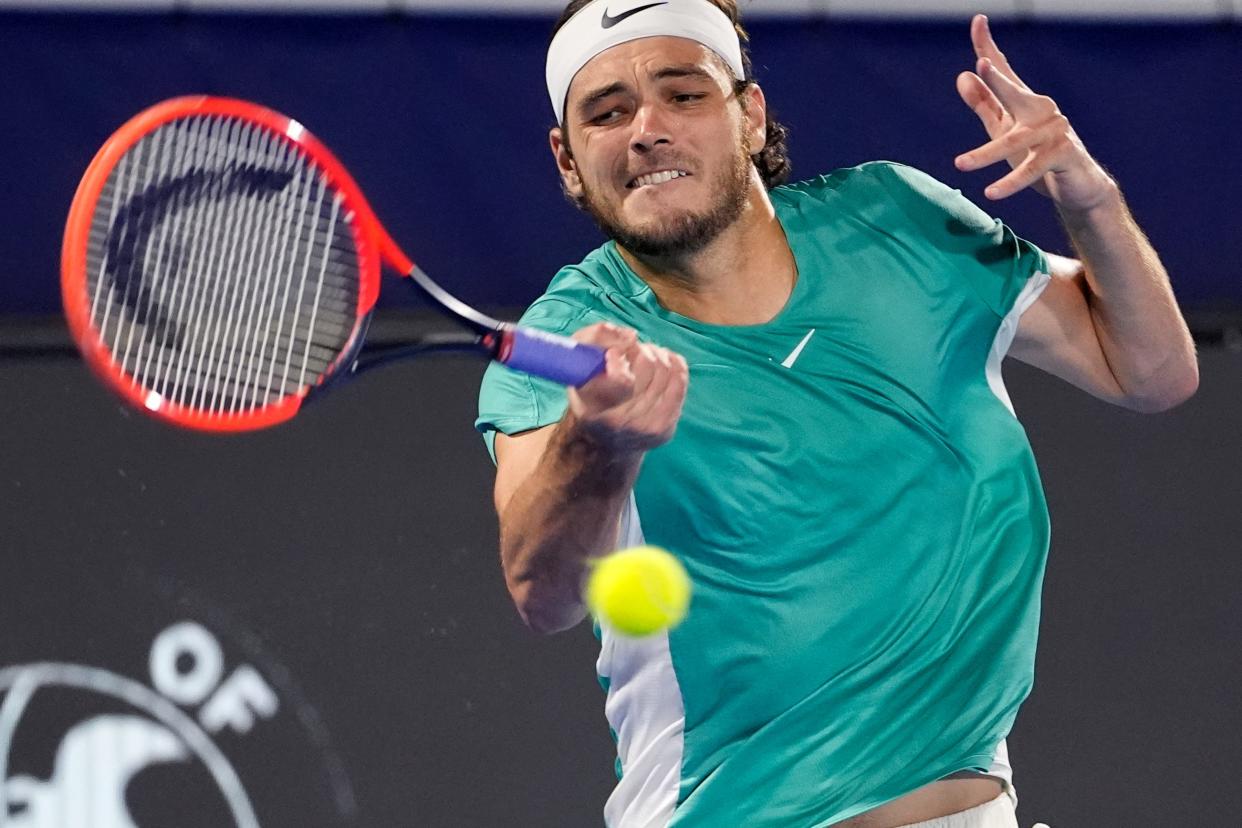 Taylor Fritz hits a return to Marcus Giron during their semifinal match at the Delray Beach Open tennis tournament, Saturday, Feb. 17, 2024, in Delray Beach, Fla. (AP Photo/Lynne Sladky)