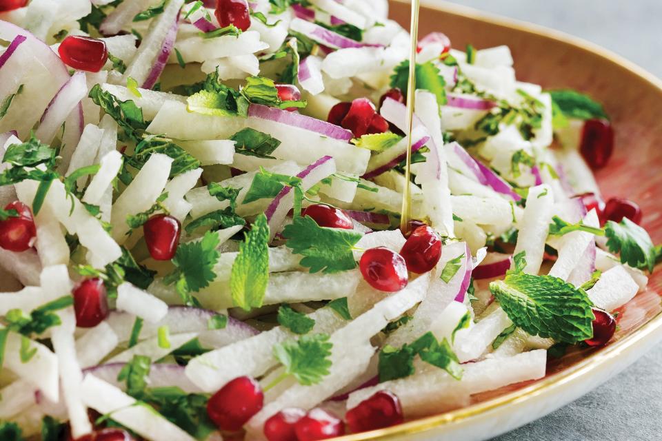 This herb-packed slaw is refreshing, tart, and crisp. You'll get a double dose of pomegranate from the addition of seeds and pomegranate molasses. <a href="https://www.epicurious.com/recipes/food/views/jicama-and-pomegranate-slaw?mbid=synd_yahoo_rss" rel="nofollow noopener" target="_blank" data-ylk="slk:See recipe.;elm:context_link;itc:0;sec:content-canvas" class="link ">See recipe.</a>