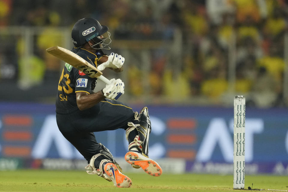 Gujarat Titans' Sai Sudharsan loses his balance as he plays a shot during the Indian Premier League cricket match between Gujarat Titans and Chennai Super Kings in Ahmedabad, India, Friday, May 10, 2024.(AP Photo/Ajit Solanki)