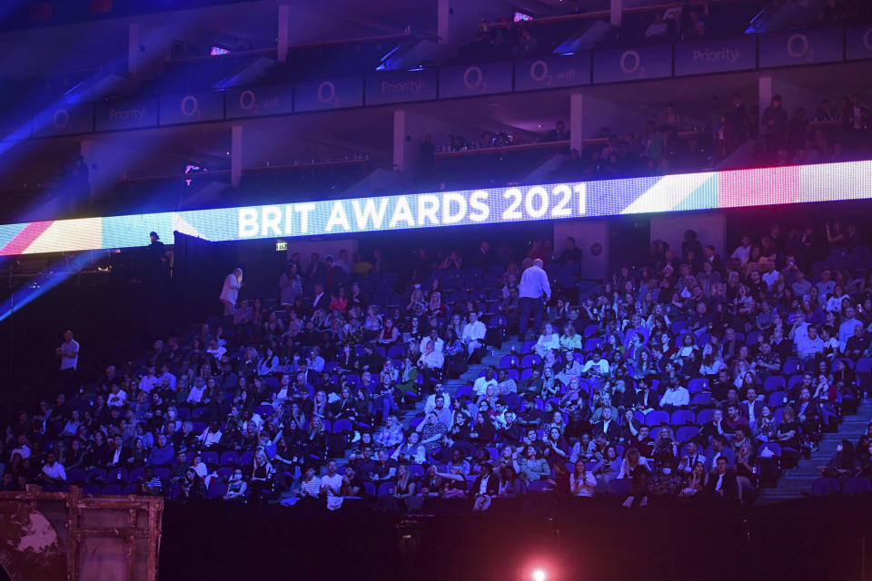 People in the crowd during the Brit Awards 2021 at the O2 Arena, in London, Tuesday, May 11, 2021. (Ian West/PA via AP)