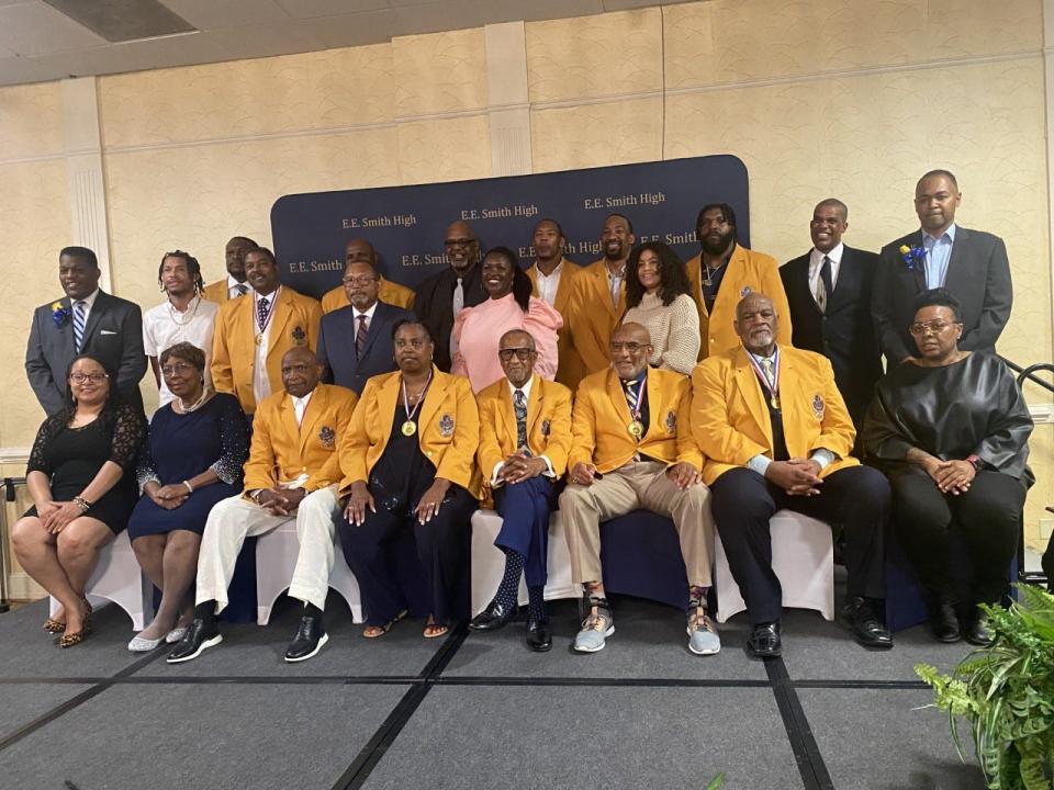 Of the 21 inductees to E.E. Smith High School's Sports Hall of Fame, 11 of them were awarded posthumously. Family members and friends accepted their awards. The living 12 inductees were given custom golden jackets as part of their  honor.