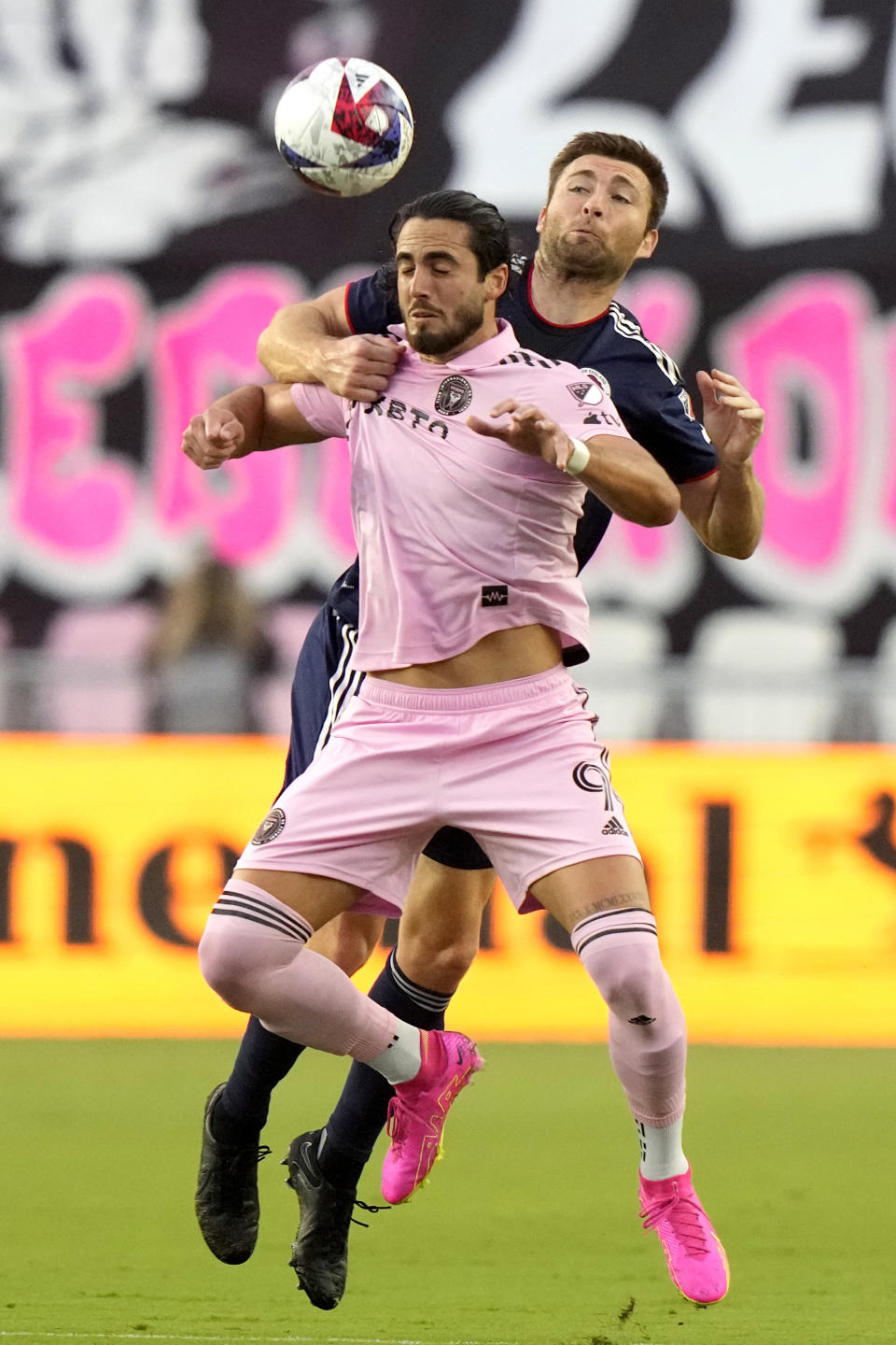 Inter Miami forward Leonardo Campana heads in the ball in front of a New England Revolution defender during the first half of an MLS soccer match, Saturday, May 13, 2023, in Fort Lauderdale, Fla. (AP Photo/Lynne Sladky)