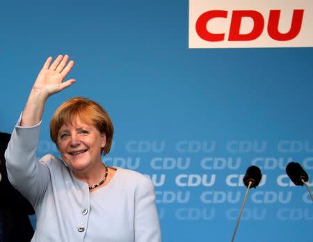 German Chancellor and chairwoman of the Christian Democratic Union (CDU) Angela Merkel waves during an election campaign rally for local city elections in Berlin, Germany, September 14, 2016. REUTERS/Fabrizio Bensch