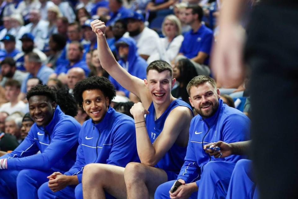 Kentucky forward Zvonimir Ivisic, who arrived on campus for the first time Thursday, waves to fans from the bench during Big Blue Madness. Ivisic was introduced to the crowd but did not participate in any basketball activities.