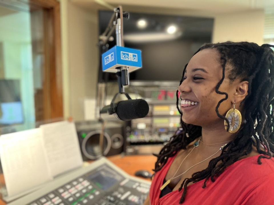 T’Keyah Thomas, on-air host and media producer, smiles Monday while on air inside the KBIA public radio studio.