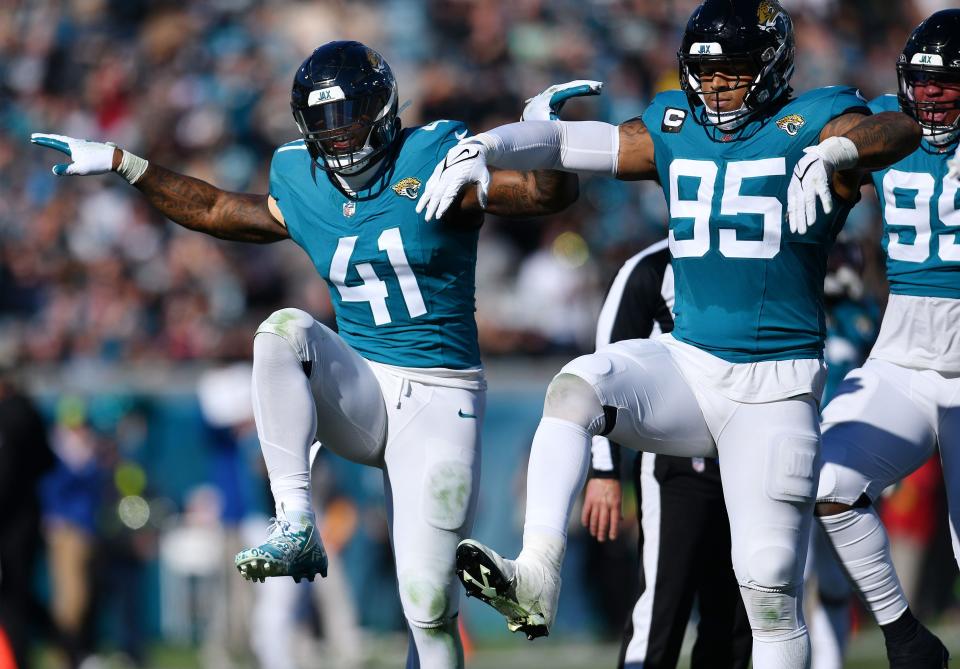 Jacksonville Jaguars outside linebacker Josh Allen (41), seen here celebrating with Roy Robertson-Harris (95) when he set the single-season sack record against the Carolina Panthers, was one of the few bright spots on a defense that crumbled in the second half of the season.