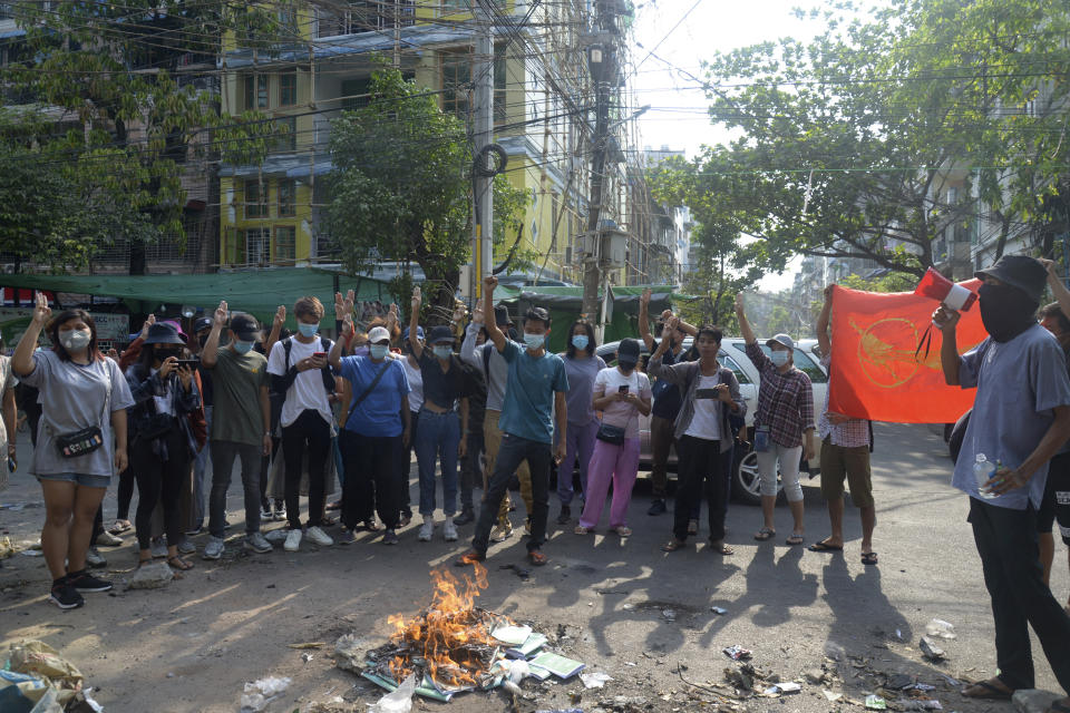 Anti-coup protesters burn constitution books at Tarmwe township in Yangon, Myanmar Thursday April 1, 2021. Opponents of Myanmar’s military government declared the country’s 2008 constitution void and put forward an interim replacement charter late Wednesday in a major political challenge to the ruling junta. (AP Photo)