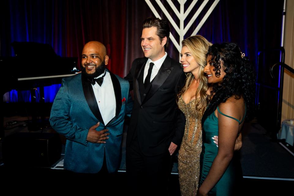 <br>Vish Burra poses with Florida Rep. Matt Gaetz, his wife, Ginger, and another gala attendee (from left). Burra worked for Gaetz as he was investigated.